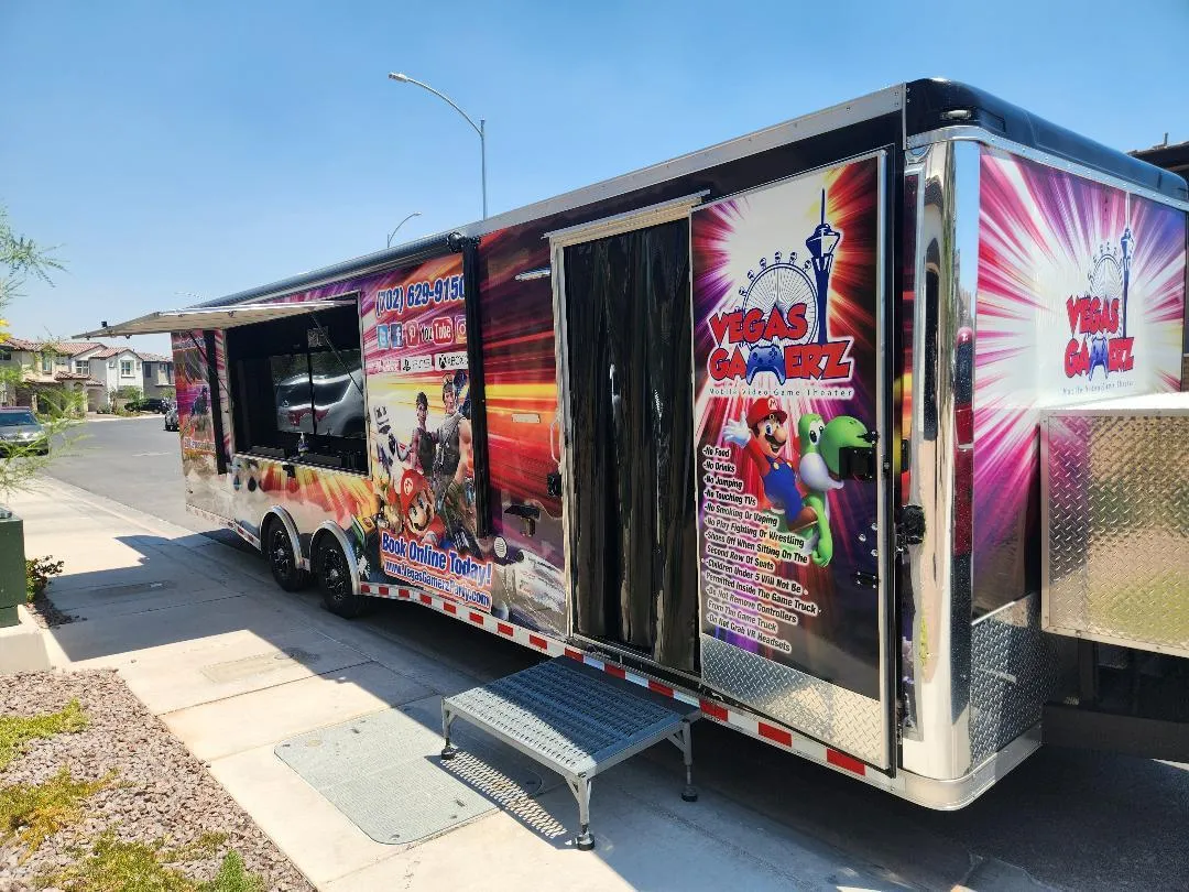 The trailer parked on a residential street with its door open and entry step down