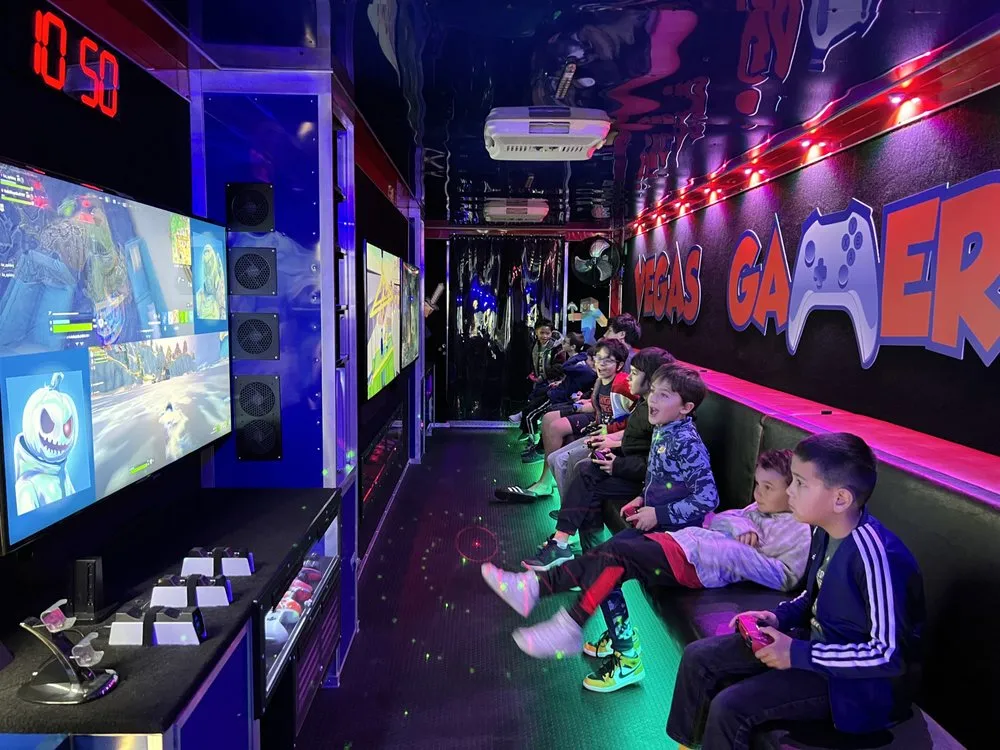 Eight 4K screens running at once along the inside of the trailer with kids playing on the bench